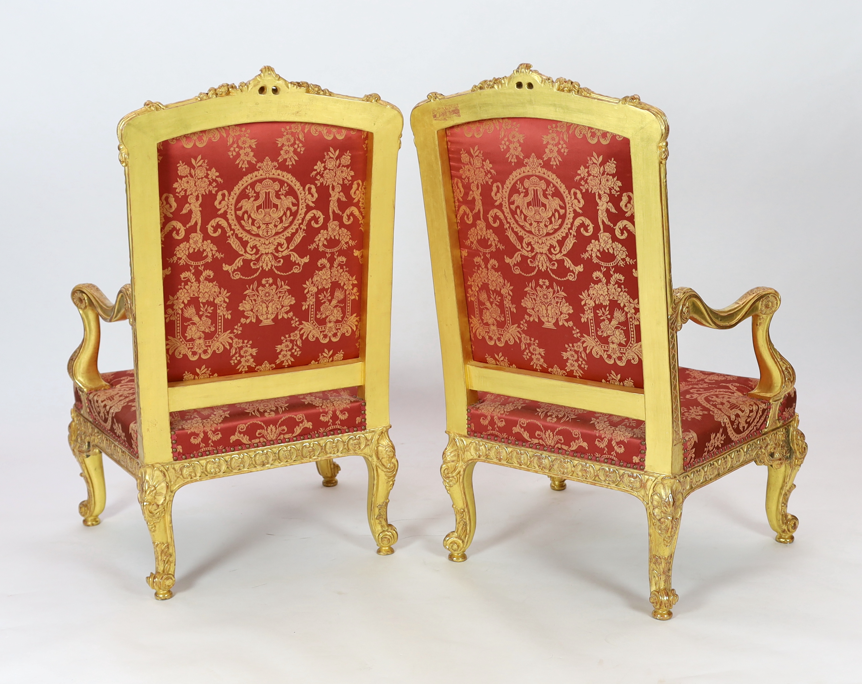 A pair of Louis XV style carved giltwood fauteuils Please note this lot attracts an additional import tax of 5% on the hammer price